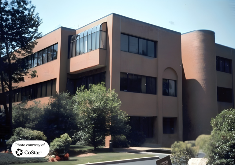 The modern professional multi-story office building exterior facade and landscaped grounds of 2960 Post Road Southport.
