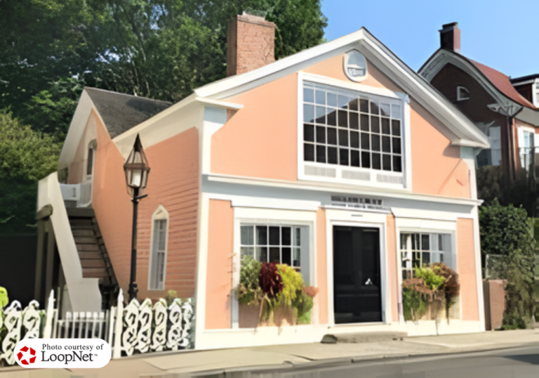The elegant boutique waterfront exterior facade and scenic harbor setting of 656 Harbor Road Southport.