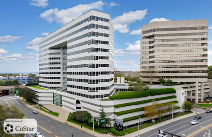 The sleek high-rise exterior facade of 107 Elm Street Stamford within the Stamford Plaza complex.