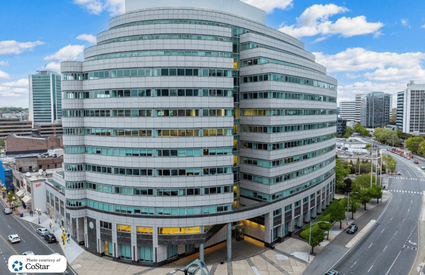 Modern glass facade of 300 Atlantic Street commercial property in Stamford, Connecticut.