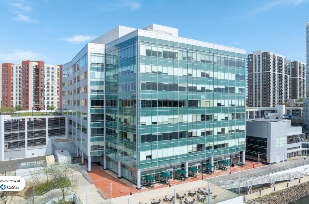 Aerial view of the contemporary waterfront glass exterior of 2200 Atlantic Street Stamford, also known as The Maritime Building.